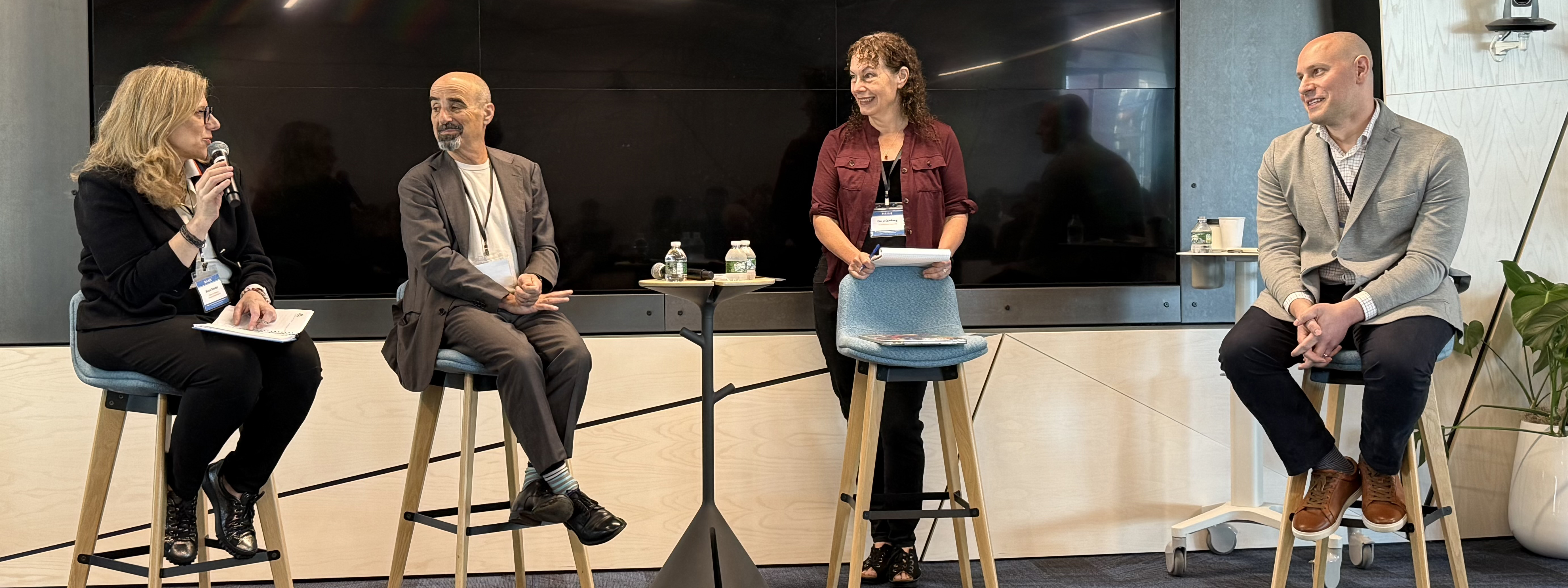 Brendel and panelists at RAISE 2025.
