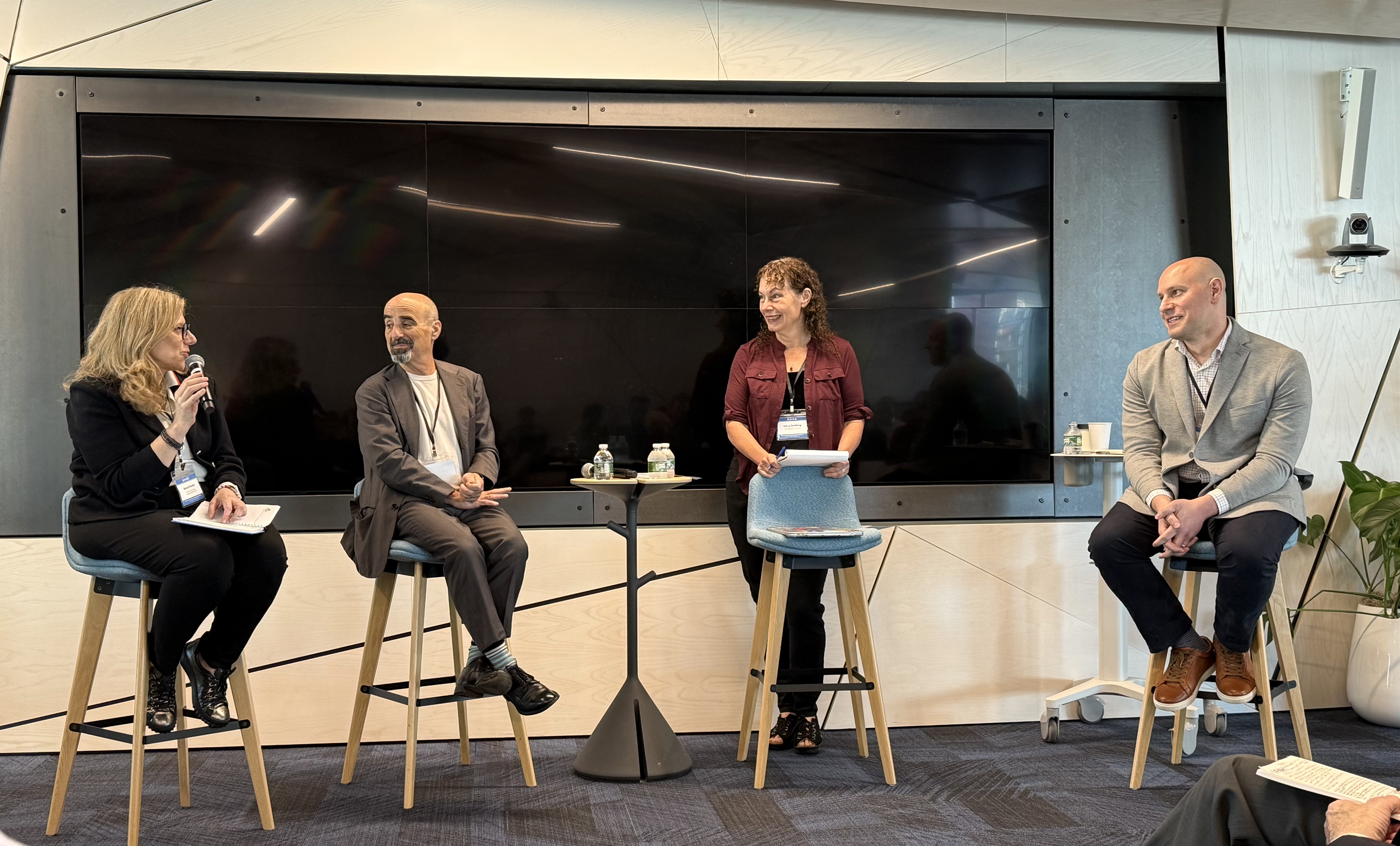 Brendel and panelists at RAISE 2025.