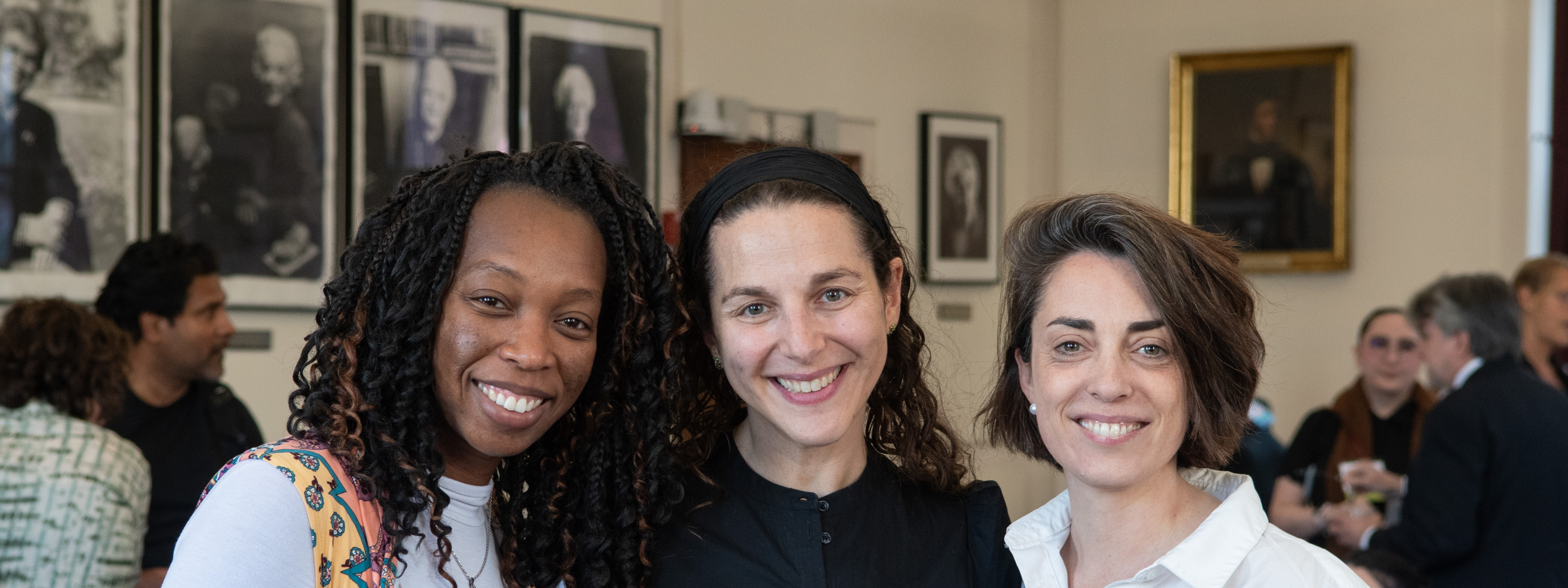 Fellows smiling, meeting in person.