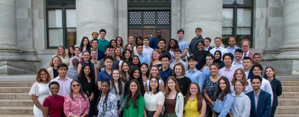 Group of MBE students and Center staff on exterior steps of Gordon Hall.