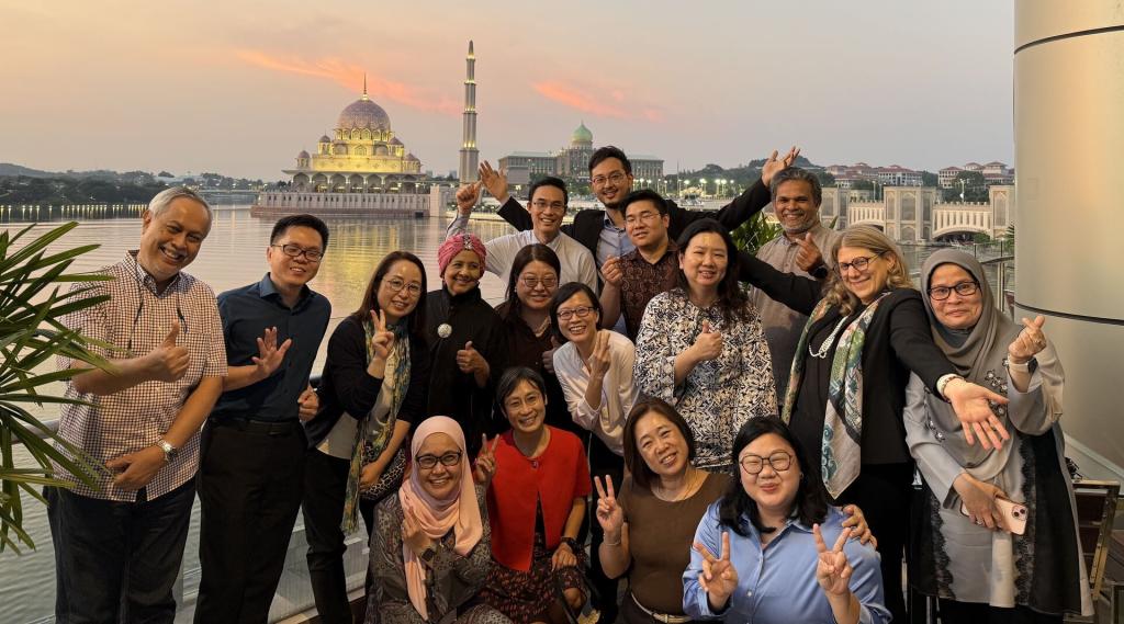 Brendel with alumni and colleagues overseas.