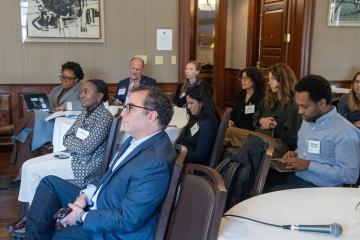 Summit participants watching a spark talk.