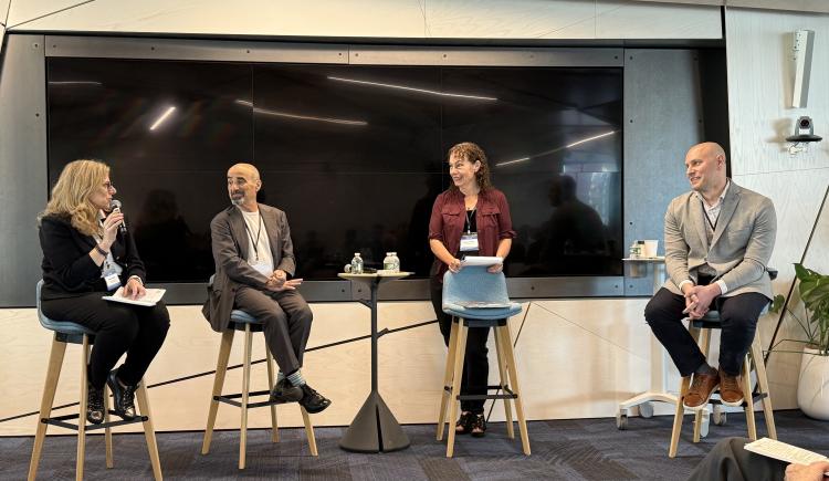 Brendel and panelists at RAISE 2025.