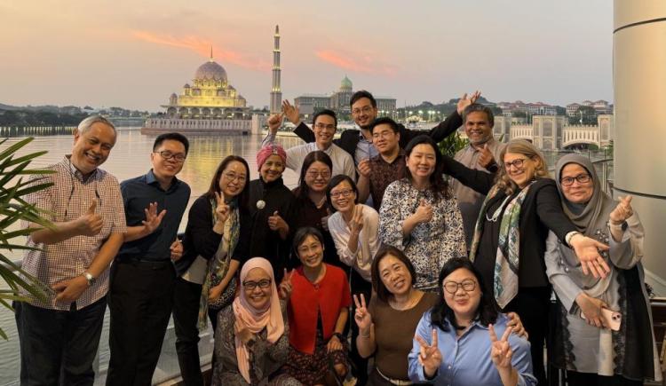 Brendel with alumni and colleagues overseas.