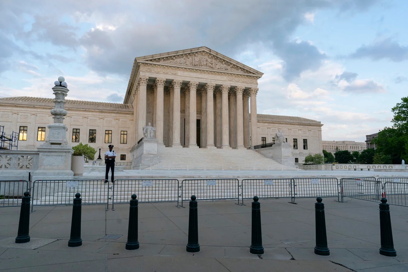 View of Supreme Court exterior with guard