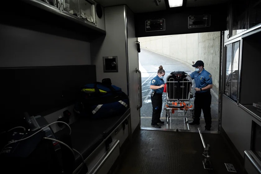 Paramedics bring a patient to the hospital. Jon Cherry/Getty Images
